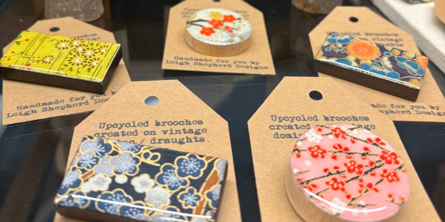 A selection of colourful handmade brooches.