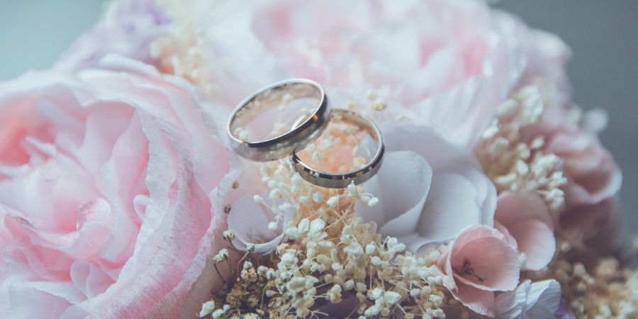 Wedding rings and flowers.