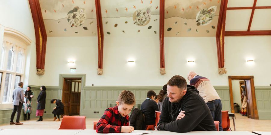 A father and son visiting The Bright Hall at Rochdale Town Hall.