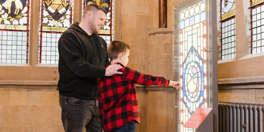 Visitors looking at the stained glass on display at Rochdale Town Hall.