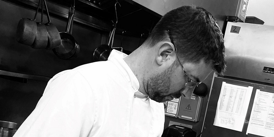 Darren Parkinson working in a kitchen.